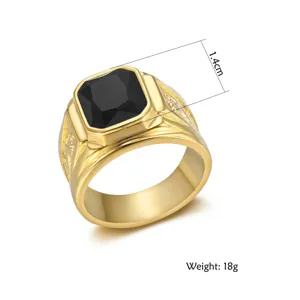 Detail view of men's gold titanium steel ring with black gemstone and dragon motif