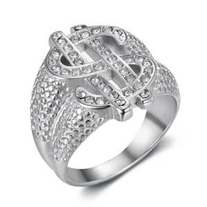 Detailed macro view of hip hop dollar sign ring with sparkling pavé rhinestones
