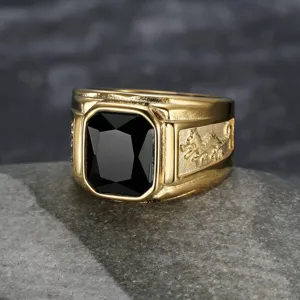 Macro view of gold titanium steel ring with rectangular black gem and dragon detail