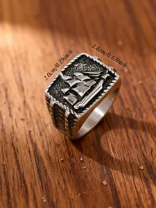 Detail shot of vintage stainless steel ring with engraved sailing ship and size info