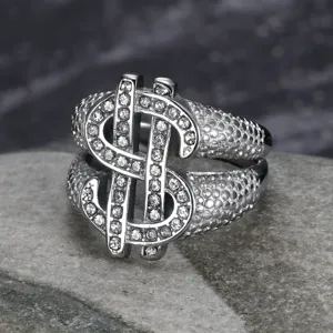 Detailed macro shot of iced-out dollar sign ring with textured stainless steel band