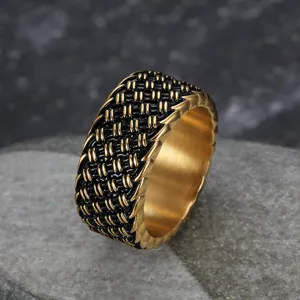 Vintage woven stainless steel ring with black and gold punk style texture