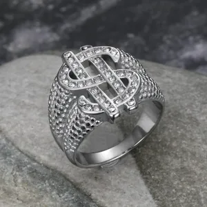 Detailed close-up of a stainless steel hip-hop ring featuring a diamond-set dollar sign symbol.