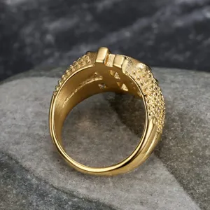 Detailed view of hip hop gold dollar sign ring with sparkling stones and textured band.