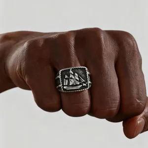 Vintage stainless steel sailboat ring with distressed nautical punk style for men.