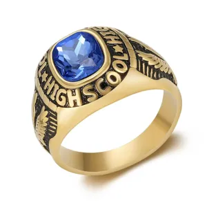 Macro detail view of vintage stainless steel eagle wing ring with blue square gemstone centerpiece