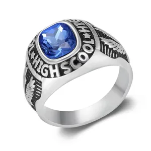Macro view of retro punk stainless steel ring with blue gemstone and eagle engraving