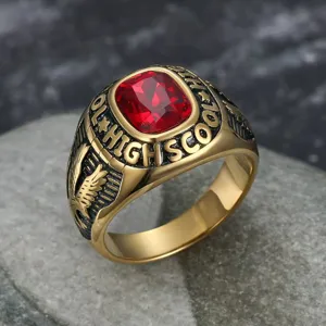 Close-up macro detail of a vintage gold eagle ring featuring a large red gemstone