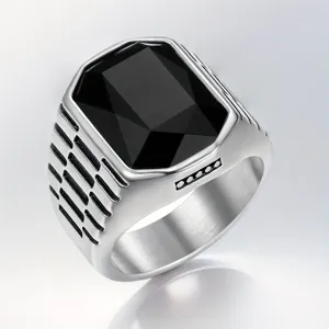 Close-up of a men's stainless steel ring with a large faceted black square gemstone