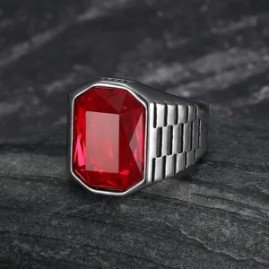 Detailed view of a silver stainless steel men's ring featuring a large red square gemstone.