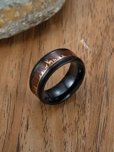 Close-up of 8mm men's black ring with wood grain inlay and gold reindeer pattern