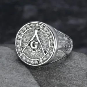 Macro detail of a silver Masonic ring with rhinestones and engraved square and compass