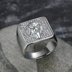 Close-up detail of a silver stainless steel lion head ring with sparkling rhinestone pavé.