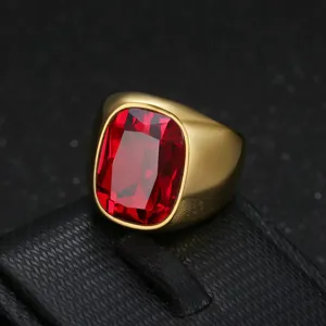 Close-up of a men's stainless steel ring with a large rectangular red gemstone