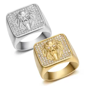 Close-up of men's lion head signet rings in gold and silver steel finishes with rhinestones