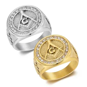 Macro view of gold and silver Freemason masonry rings with sparkling rhinestones