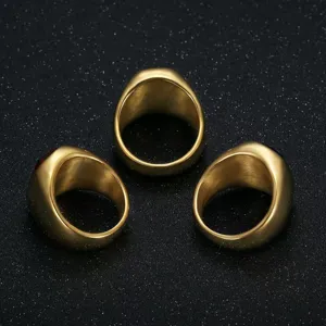 Set of three men's gold stainless steel signet rings with red zircon gemstones