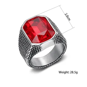 Detail view of men's vintage stainless steel ring with 2.0cm wide red zircon stone