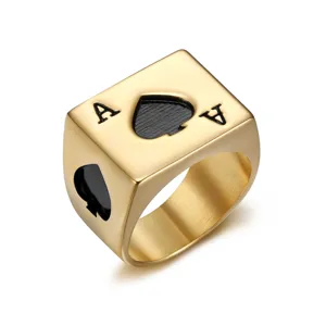 Close-up of a vintage golden stainless steel square ring with black Ace of Spades poker design