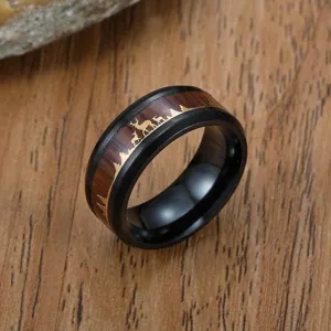 Men's black stainless steel ring with wood grain inlay and gold reindeer forest scene