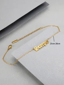 Close-up view of a gold Scorpio zodiac anklet with an adjustable 23-28cm chain length