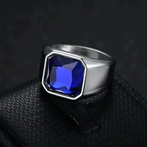 Detailed view of a vintage men's stainless steel ring featuring a large blue gemstone