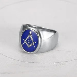 Detailed macro view of a men's silver Freemasonry ring with blue enamel and G symbol