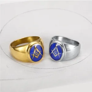 Detailed view of gold and silver Freemason rings with blue enamel and G symbol