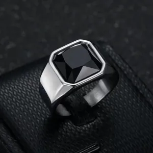 Macro view of a men's stainless steel ring featuring a square black gemstone inlay