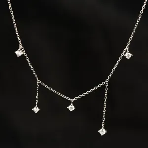 Close-up view of the sparkling silver zircon multi-drop necklace highlighting delicate chain links.