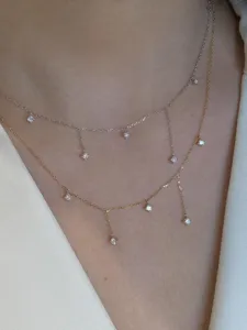 Close-up detail shot of double-layered sterling silver cubic zirconia tassel necklace