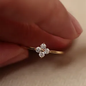 Close-up detail of delicate S925 silver four-leaf clover ring featuring sparkling stones.