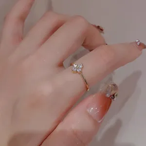 Exquisite gold-plated clover ring with sparkling micro diamonds, delicate and stylish detail.