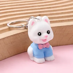 Grazioso portachiavi con cagnolino dei cartoni animati in abito blu per borsa e chiavi auto.