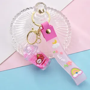 Porte-clés mignon en caoutchouc souple translucide avec pendentif tasse de thé au lait.