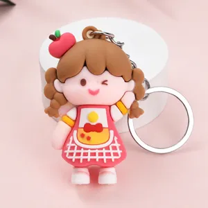 Cute cartoon girl keychain pendant detail view, lovely silicone doll accessory with metal ring.