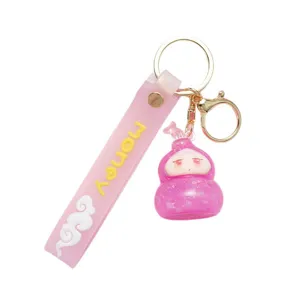 Cute pink lucky doll keychain with money strap and sparkling gourd pendant for bags.
