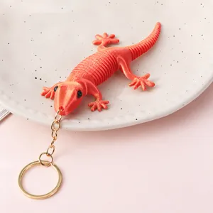 Cute 3D printed articulated lizard keychain, flexible stress relief toy pendant for keys.