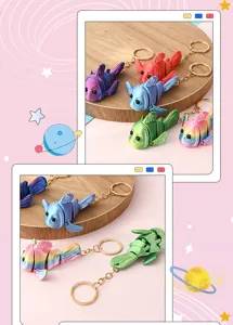Detailed shot of colorful 3d printed articulated fish keychains displayed on a round wooden tray.