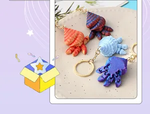Close-up of colorful articulated hermit crab keychains, flexible 3D printed toy pendant.