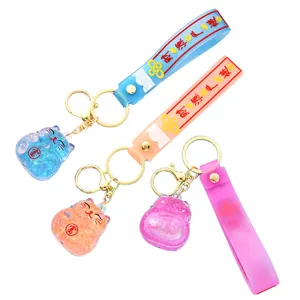 Creative quicksand lucky cat keychain acrylic oil-in car pendant cute bag charm gift