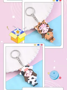 Cute cartoon zodiac girl keychain with tiger and cow designs, perfect bag charm pendant gift.