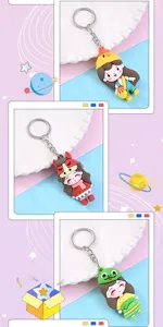 Close-up detail view of cute cartoon zodiac girl keychain pendants with metal rings.