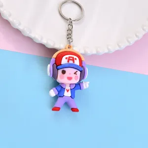 Schattige cartoon koptelefoon jongen sleutelhanger, PVC zacht rubberen rugzakhanger.