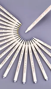 Detail view of gold and silver metallic markers for DIY crafts and greeting cards.