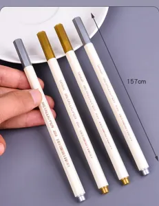 Detailed close-up view of metallic gold and silver marker pens with length dimension
