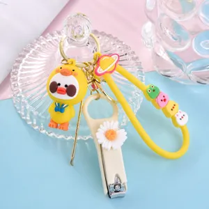 Leuke cartoon eend nagelknipper oorsteker set sleutelhanger met madeliefje hanger.