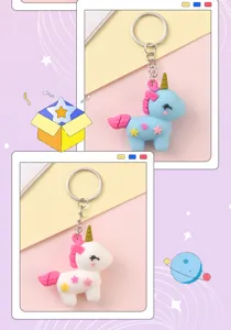 Cute soft rubber unicorn keychain detail display, featuring blue and white cartoon pony pendant.