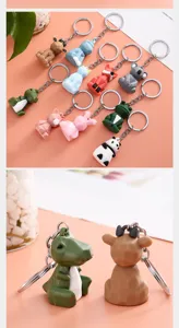 Detailed view of geometric pixel animal keychain charms, cute PVC soft rubber key rings.