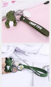 Cute geometric cartoon animal keychain detail view, stylish dinosaur design metal bag charm.